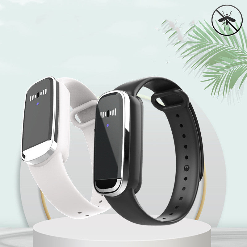 White ultrasonic mosquito repellent bracelet on a baby's wrist, showing a chemical-free electronic mosquito protection device.