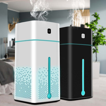 A white 2-in-1 air purifier and humidifier with HEPA filter, releasing a gentle cool mist while purifying indoor air in a modern bedroom.