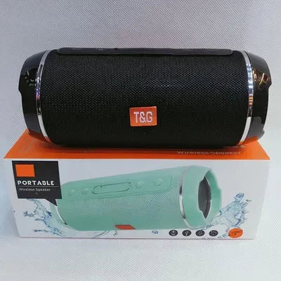 Compact portable Bluetooth speaker with visible bass radiators, delivering high-fidelity wireless audio for outdoor and home use.