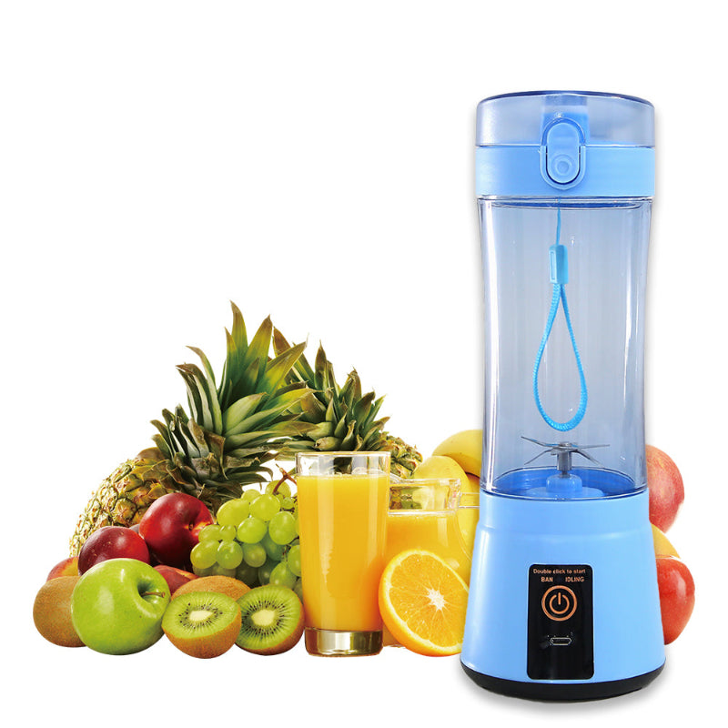 Blue portable blender with fruits and a glass of juice on a white background