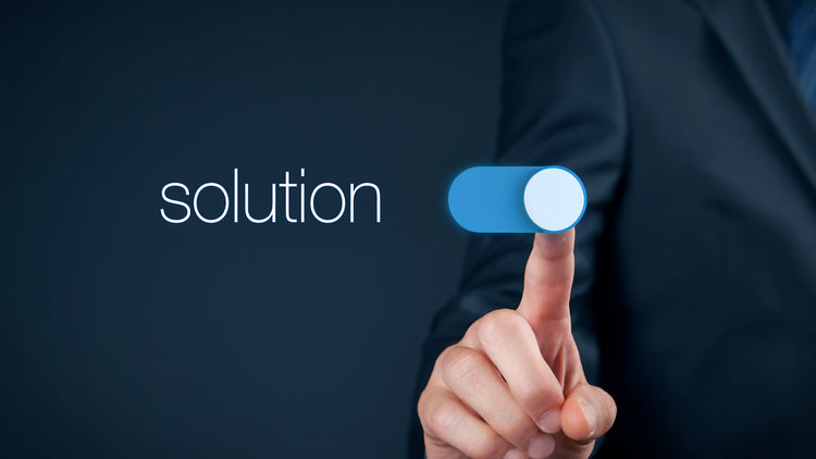 Hand pressing a 'solution' button on a dark background