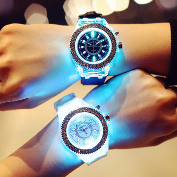 Geneva LED luminous watch for women with a white silicone band, glowing with colorful lights in the dark.