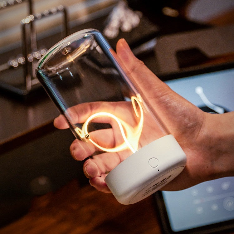 Vintage-style rechargeable LED camping lantern in black with a hanging hook, providing warm atmosphere light for outdoor tents and hiking.