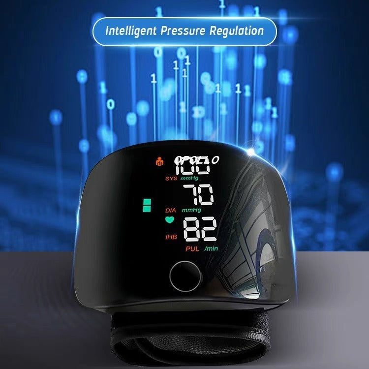 Rechargeable wrist blood pressure monitor with a large backlit LCD display showing systolic, diastolic, and pulse readings.