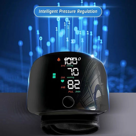 Rechargeable wrist blood pressure monitor with a large backlit LCD display showing systolic, diastolic, and pulse readings.