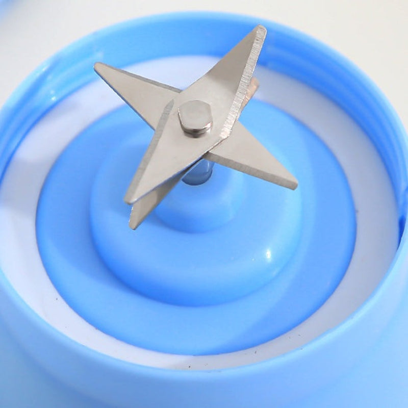 Metal blade on a blue plastic base against a white background